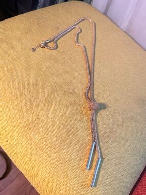 Gold-Tone Knot Lariat Necklace with Tube Tassels after a brand from Barcelona